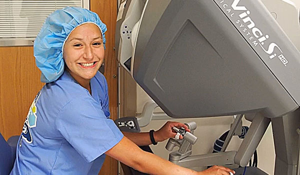 Gabrielle Burkard practices on the da Vinci surgical robot while she participates in the Junior Robotic Surgery Challenge over the summer at Roswell Park Cancer Institute. Burkard, a junior at St. Mary's High School, took part in the challenge where participants experienced career opportunities within health care using hands-on, practical exercises and classroom instruction, as well as guest lectures from accomplished professionals. 