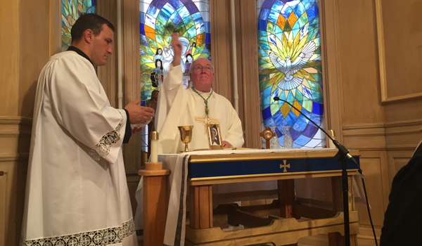 Bishop Richard J. Malone blesses the chapel at the new Mother Teresa Home. (Patrick McPartland/Managing Editor)