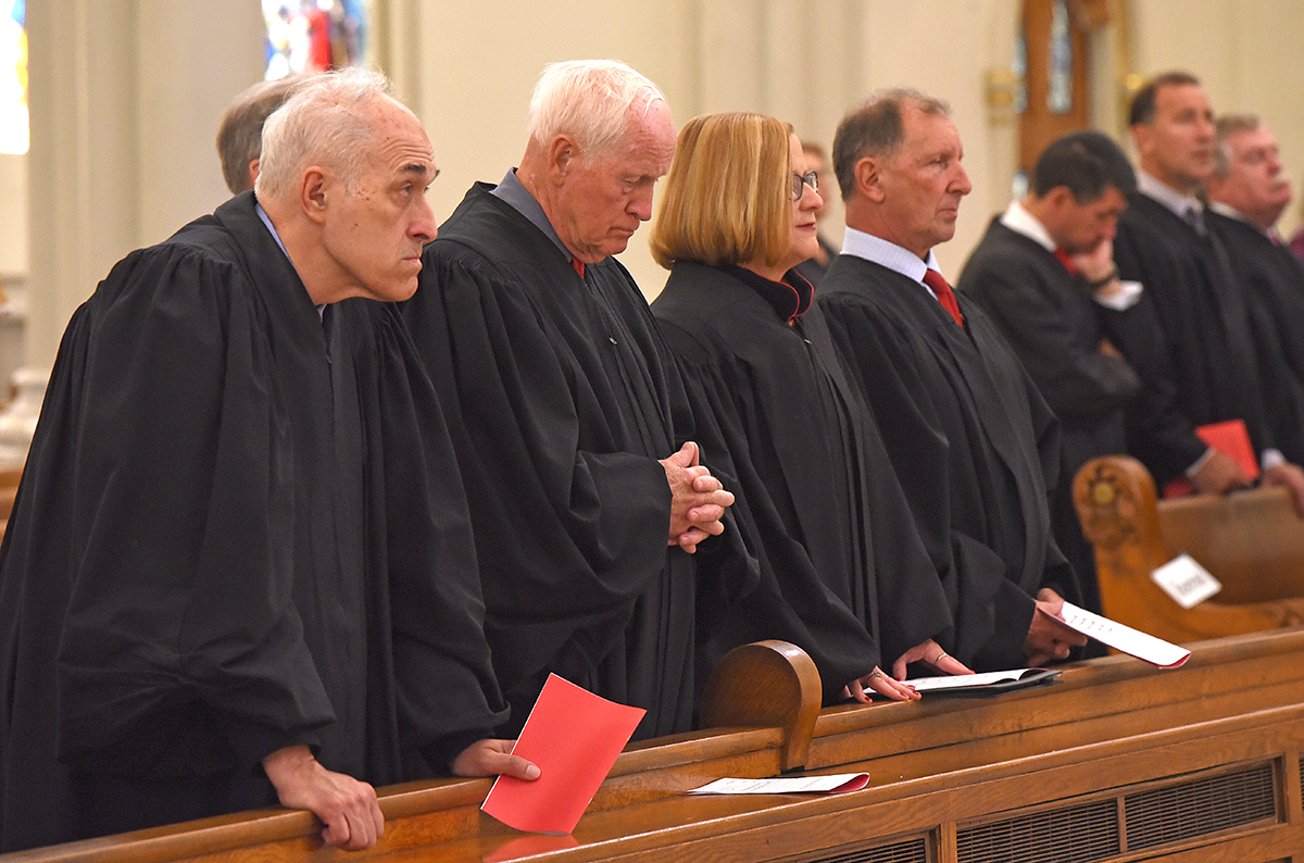 Area judges pray at St. Joseph's Cathedral during the annual Red Mass. The Mass recognizes the contributions of  tribute area lawyers and judges to the greater good.

Dan Cappellazzo/Staff Photographer