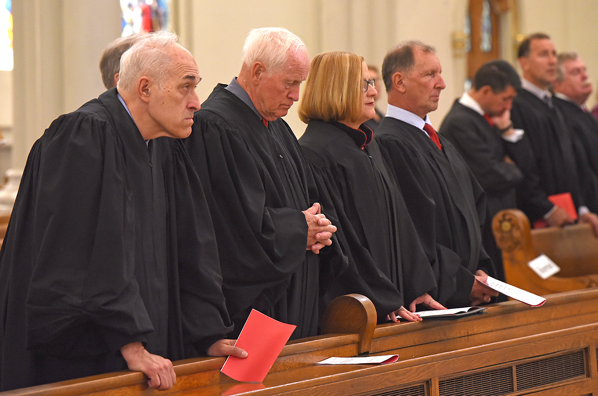 Area judges pray at St. Joseph's Cathedral during the annual Red Mass. The Mass recognizes the contributions of  tribute area lawyers and judges to the greater good.

Dan Cappellazzo/Staff Photographer