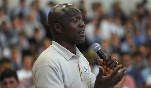 St Joe's students listen to Thomas Awiapo, originally from Ghana, tell his story. Awiapo was helped by Catholic missionaries to receive an education and come to the United States. (Dan Cappellazzo/Staff Photographer)