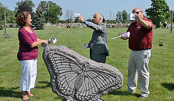 Butterflies are released at a new section of Gate of Heaven Cemetery, Lewiston, specifically for unborn children under 20 weeks. The project is a joint effort between Mount St. Mary's Hospital, Lewiston, and the Catholic Cemeteries of the Diocese of Buffalo. Mount St. Mary's Hospital, who requested the section, is less than two miles from the cemetery. Stone Art Memorial has donated a monument in the shape of a butterfly for this special section. (Patrick McPartland/Managing Editor)