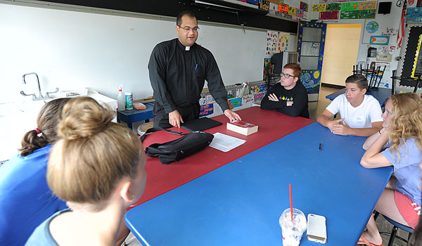 Father Andrew Lauricella has been director of the Vocations office for over a year. Meeting and working with young people is part of his ministry. (Patrick McPartland/Managing Editor)