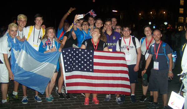 Laura Szczepankiewicz meets and photographs new friends at World Youth Day in Krakow, Poland. (Patrick J. Buechi/Staff)