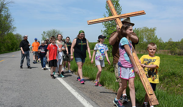 Teens from St. Brendan on the Lake, Newfane, carried their own cross 15 miles in May to prepare for World Youth Day 2016. (Patrick McPartland/Staff Photographer)