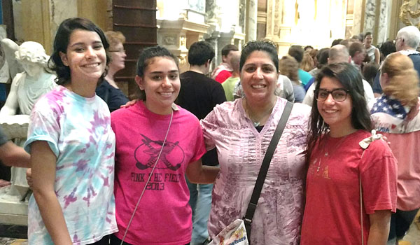 Julia, Veronika, Rachel and Maria Tibold take a moment for a family photo at Our Lady of Victory Basilica before heading out to Krakow, Poland for World Youth Day. The Tibolds turned the church event into a family event when mother Rachel joined three of her daughters on the pilgrimage. 