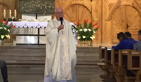 Bishop Richard J. Malone celebrates Mass at the Church of Our Lady Revealing the Miraculous Medal, in the mountain town of Zakopane on Aug. 1. The bishop had the opportunity to celebrate Mass with the World Youth Day pilgrims from Buffalo on several occasion during the Poland trek. (Patrick J. Buechi/Staff)