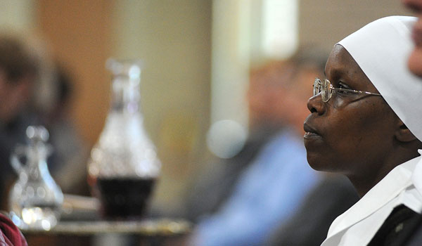 A religious sister listens as Bishop Richard J. Malone speaks at St. Rose of Lima Church in North Buffalo for World Mission Sunday. (Photo by Dan Cappellazzo/Staff Photographer)