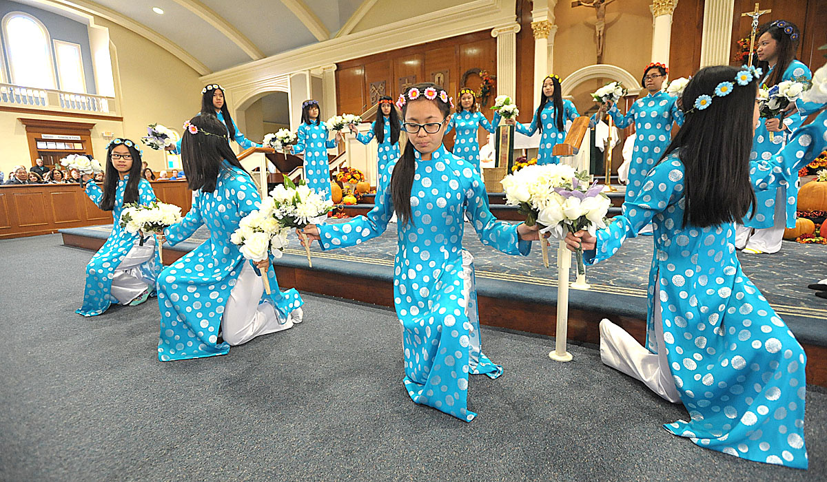 Vietnamese Praise Dancers from Coronation Parish, Buffalo, at World Mission Sunday celebration at Nativity of the Blessed Virgin Mary Parish in Harris Hill. (Patrick McPartland/Staff Photographer) 