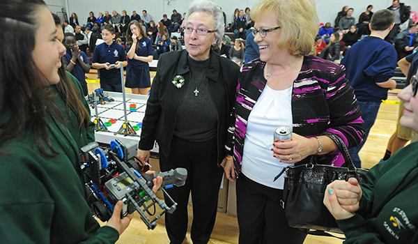 Sister Carol Cimino, SSJ, superintendent of Catholic Schools for the Diocese of Buffalo (center) shares a laugh with a student at the X-STREAM Games & Expo. Sr. Carol accompanied Pamela Bernards, Ed. D., director of professional development for the National Catholic Educational Association (right). Dan Cappellazzo/Staff Photographer 