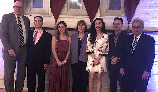 Four Cardinal O'Hara High School seniors pose with three O'Hara alumni after the Ken-Ton Friends of the Youth Shining Stars dinner, held April 26 at the Tonawanda Castle. The group includes (from left) Town of Tonawanda Supervisor Joseph Emminger '77; O'Hara seniors Dean Adams and Nicole Caputi; O'Hara Principal Mary Holzerland '70; students Grace Muscarella and Jake Adams; and New York State Assemblyman Robin Schimminger '65.