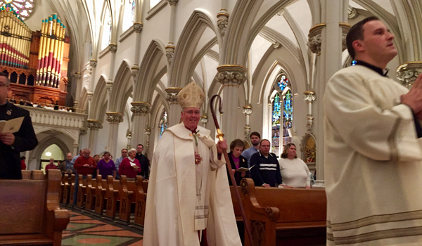 Bishop Malone during the procession to begin the Evening Prayer service to conclude the Year of Mercy at St. Joseph Cathedral Sunday. (Photo by Mark Ciemcioch)