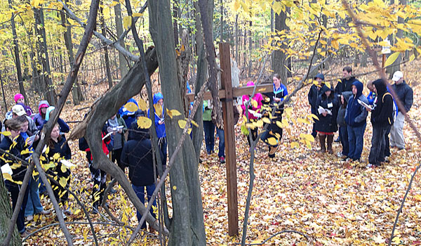 In the woods behind Christ the King Seminary, dozens of young adults gather for prayer and reflection.