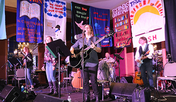 Area Catholic teens sing, dance and rejoice to the sounds of the Carrie Ford band during `True Story,` the 66th Annual Diocesan Youth Convention at the Adam Mark Hotel. Hundreds of Catholic teens from across Western New York Attend the three-day convention where they strengthen their faith, bond with others and celebrate the word of the Lord. (Dan Cappellazzo/Staff Photographer)