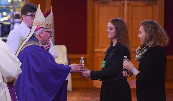 Bishop Richard J. Malone accepts the offertory during the closing liturgy of the 66th annual Diocesan Youth Convention. The convention was held over three days at the Adams Mark Hotel. (Patrick McPartland/Managing Editor)