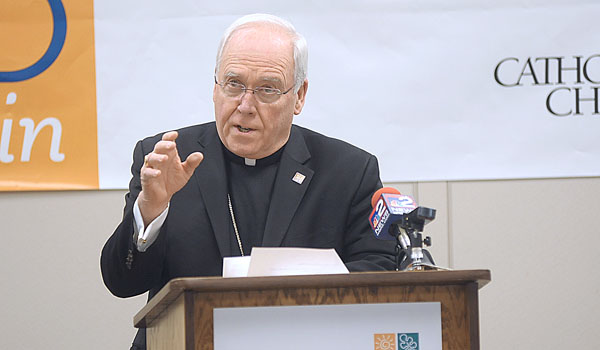 Bishop Richard J. Malone announces the total amount raised to date for the 2016 Catholic Charities Appeal is $8 million of the $11 million goal. (Patrick McPartland/Staff Photographer)