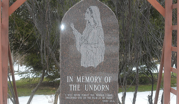 The final resting place for `Baby Jesse` the fetus found on the shore of Lake Erie. Cheryl Calire, director of Pro-Life Activities and Father Dennis Riter, pastor of St. Elizabeth Ann Seaton Parish in Dunkirk, led the service. 
(Patrick J. Buechi/Staff)