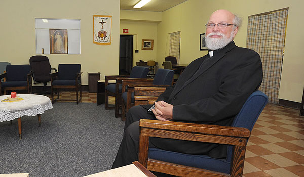 Father Martin Moleski, SJ, helps with the spiritual needs of recovering alcoholics through the Calix Society. (Patrick McPartland/Staff Photographer)