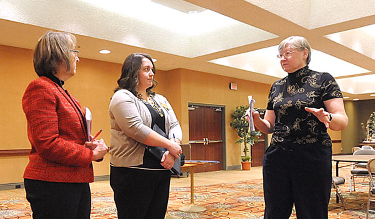 Maureen Poulin, office of Lifelong Faith Formation, Danielle Winiarski, convention and event service manager and Joanie McKweon, conference liaison to National Conference for Catechetical Leadership, discuss ideas as planners for the National Conference for Catechetical Leadership perform a walk through at the Buffalo Niagara Convention Center in Buffalo.
(Patrick McPartland/Staff Photographer)