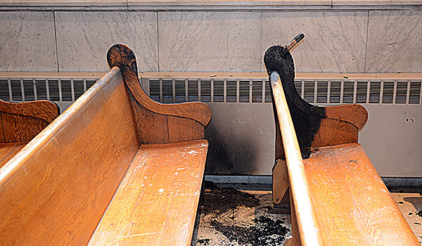 Pews were damaged by a fire inside St. Joseph Cathedral on Friday morning. (Patrick McPartland/Staff Photographer)