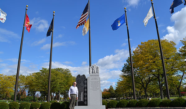 Jim Janusz, Catholic Cemeteries Family Service Counselor and U.S. Army veteran, stands on the Veterans Plaza at Mount Olivet Cemetery. (Courtesy of Kevin A. Keenan)