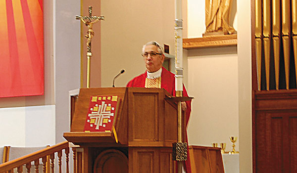 Father Richard DiGiulio gives the homily at the Pentecost Mass spnosored by the Office of Charismatic Renewal, which took place at Our Lady of Pompeii Church in Lancaster in May. (Rick Franusiak/Managing Editor)
