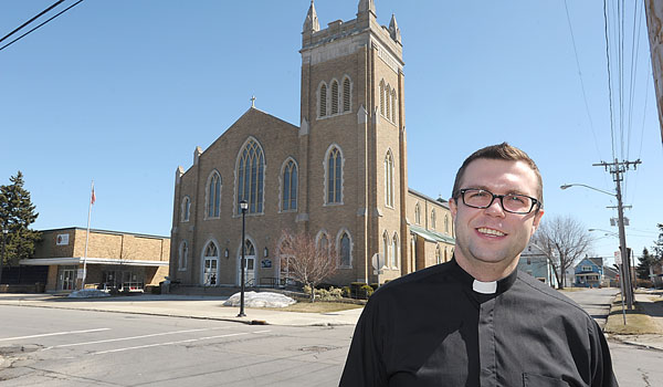 Father Marcin Pordada is serving at St. John Gualbert Parish in Cheektowaga. (Patrick McPartland/Staff Photographer)