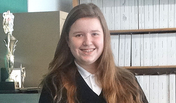 Julia Dunn, a sophomore at Cardinal O'Hara High School, practices one of the songs she will sing with the Buffalo Philharmonic Orchestra with Cardinal O'Hara's vocal and choral teacher Colin Sperrazza. 