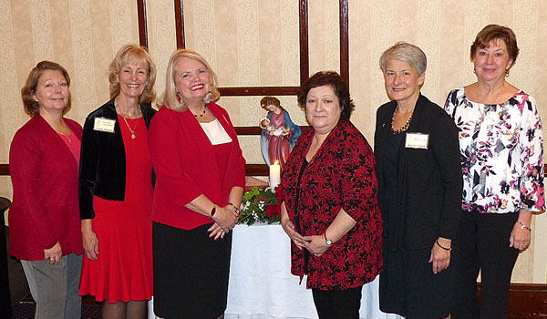 Members of Magnificat planning the anniversary celebration are Liz McCormick (left to right), corresponding secretary; Cindy Watson, assistant coordinator; Evelyn Morcelle, coordinator; Judy Swain, recording secretary; MaryKay Schaub, historian; and Christine Holden, treasurer. 