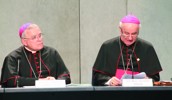 Archbishop Charles Chaput (left) of Philadelphia and Archbishop Vincenzo Paglia, president of the Pontifical Council for the Family, answer questions at the Vatican Press Office about the 2015 World Meeting of Families. (Catholic News Agency)