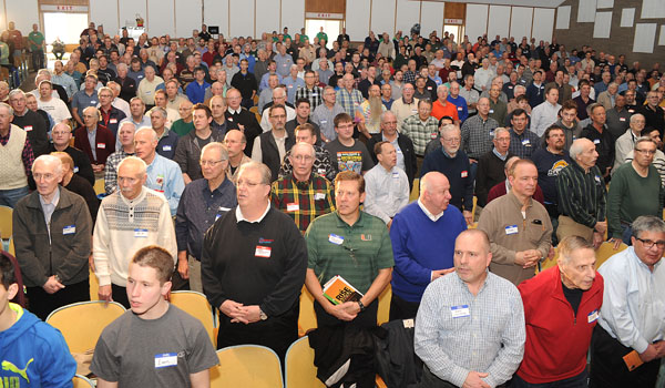 Area Catholic men listen as Bishop Richard J. Malone celebrates Mass at the Cardinal O'Hara High School auditorium during the annual Catholic Men's Conference, held at the school on April 1. (Dan Cappellazzo/Staff Photographer)