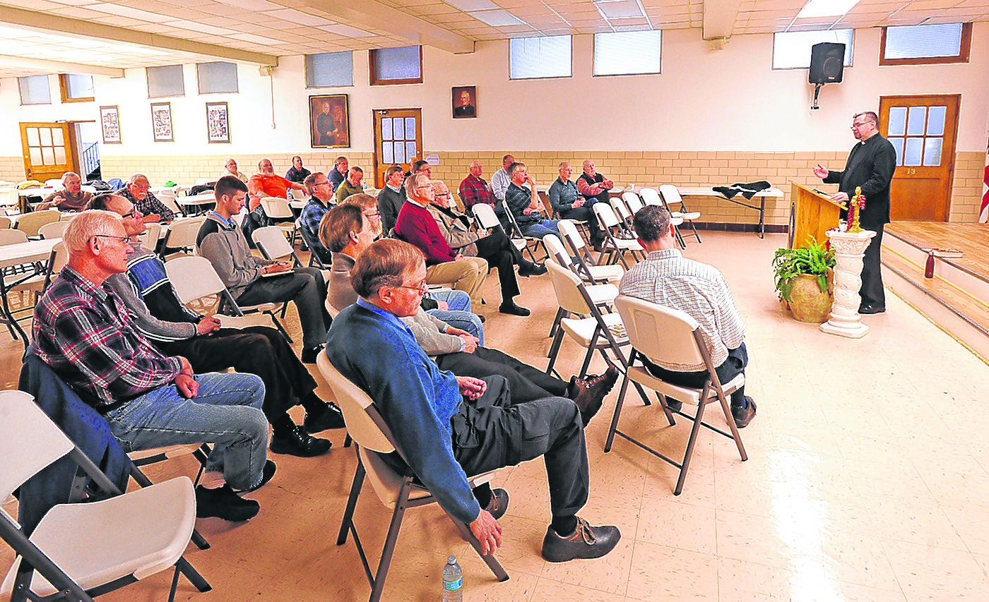 Father Jacek Mazur, of Divine Mercy Parish in Niagara Falls, speaks to area men at Blessed Sacrament Church in Tonawanda during a breakfast gathering that included Bible study. (Dan Cappellazzo/Staff Photographer)