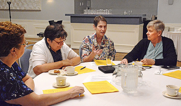 Table discussions at the Catechetical Convocation let parish leaders discuss ways already-existing small groups can effectively form missionary disciples when they intentionally share faith with each other. (Patrick McPartland/Managing Editor)