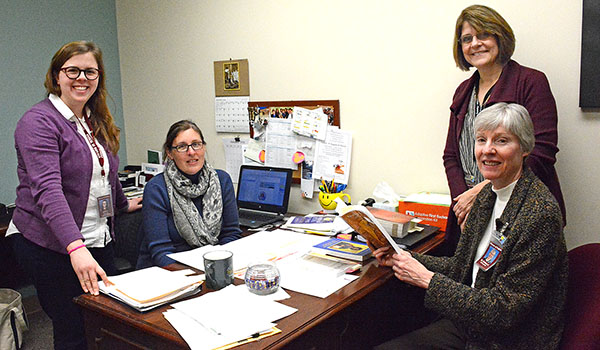 The diocesan Lifelong Faith Formation Department includes Kaitlin Garrity (from left), adolescent catechesis specialist; Megan Nixon, planning and formation specialist; Mary Beth Coates, director of Lifelong Faith Formation; and Sister Barbara Schiavoni, GNSH, associate director and coordinator of the Catechumenate. (Patrick McPartland/Managing Editor)