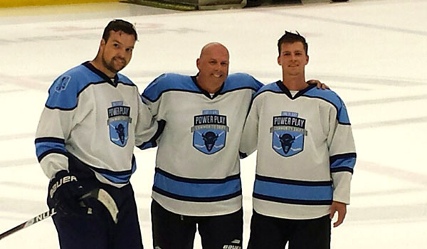 Tyler Crawford (from left), Gary Crawford and Justin Crawford participated in this year's 11-Day Power Play at the HarborCenter in downtown Buffalo. Gary, now in remission after battling Hodgkin lymphoma, skated with his sons for the first time in almost 12 years during the event. (Courtesy of Niagara University)