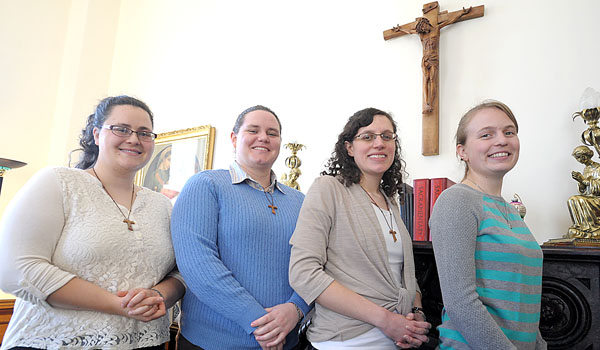 The Marian Franciscans look to become women religious and a formal community. Starting the community are Nicolette Langlois (from left), Alycia Murtha, Kristen Leaderstorf and Lindsey Martin. (Patrick McPartland/Staff Photographer)