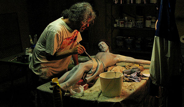 Artist Timothy Englert works on the damaged crucifix at St. Josaphat Parish in Cheektowaga. 
(Courtesy of Timothy Englert)