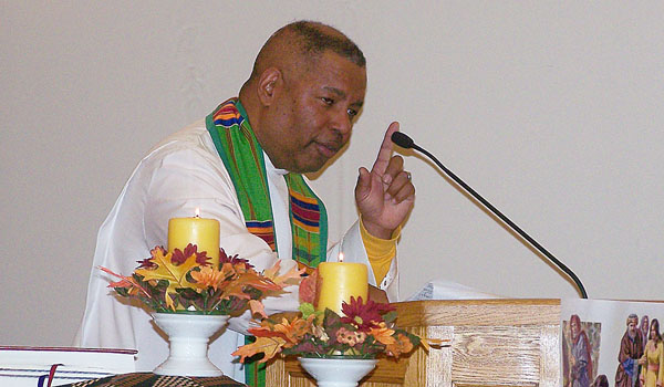 Father Chester P. Smith, SVD, speaks during the opening night of the three-day Revival at SS. Columba/Brigid Church in Buffalo on Oct. 13. (Patrick J. Buechi)