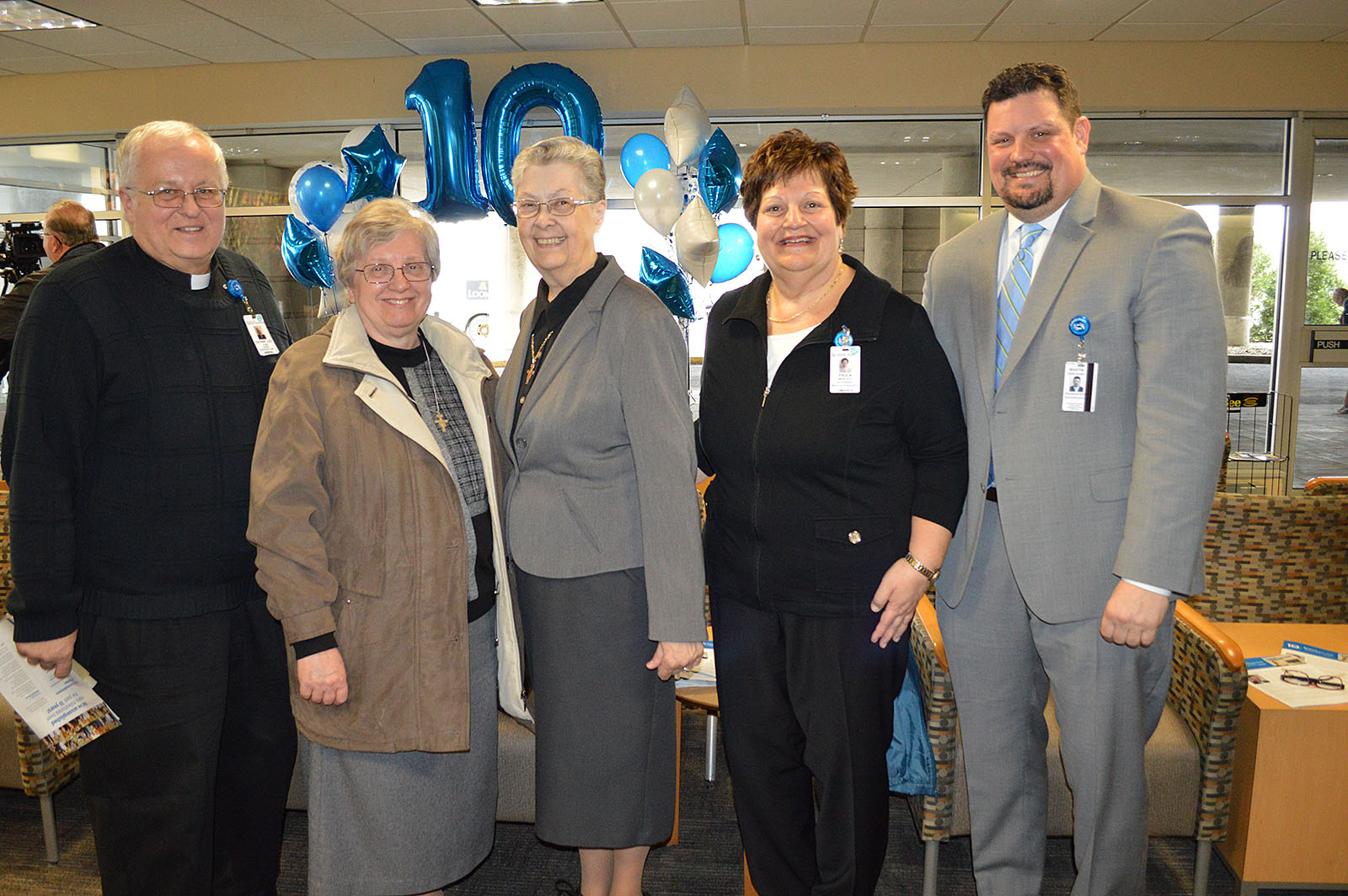 Courtesy of Sisters Hospital

Left to Right:
Father Lou Klein, Sisters Hospital chaplain; Sister Marcia Ann Fiutko, FSSJ, general minister;  
Sister Judith Salzman, FSSJ; Paula Moscato, vice president of Mission Integration, Sisters Hospital; Marty Boryszak, Sisters Hospital president and CEO help celebrate the 10 year anniversary St. Joseph Hospital coming into the Sisters Hospital Family.
