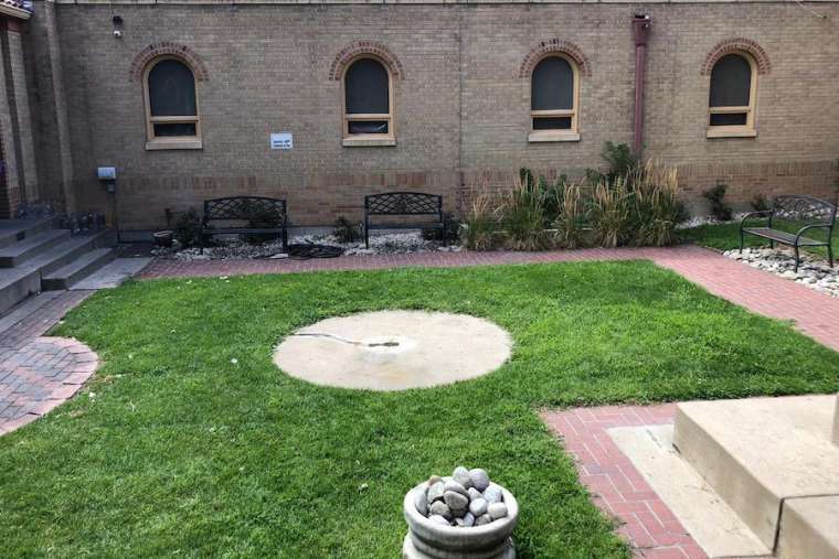 The base of a beheaded statue at Our Lady of Guadalupe Parish in Denver. Credit: David Strycula/CNA