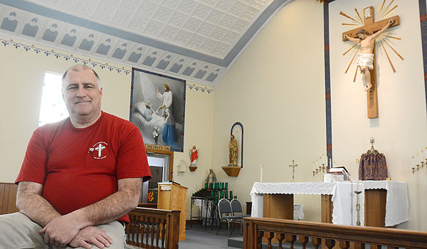 Dan Gangi, who once traveled to all the churches in the eight-county Diocese of Buffalo, relaxes in St. Joseph Oratory in LeRoy.