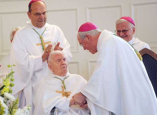 Bishop Richard J. Malone acknowledges Bishop Bernard J. McLaughlin, auxiliary bishop emeritus of the Diocese of Buffalo, at the beginning of Bishop McLaughlin's 100th birthday Mass, celebrated at St. John the Baptist Church, Kenmore. Bishop McLaughlin ser