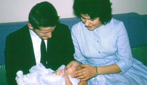 Edward Grosz holding his goddaughter Sandra Marie May with godmother Linda Piech in 1963. (Courtesy of Deacon Ted May)