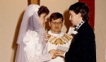 Bishop Edward M. Grosz witnessing the Marriage of his goddaughter Sandra Marie May to Robert McGreavy in January 1986. (Courtesy of Deacon Ted May)