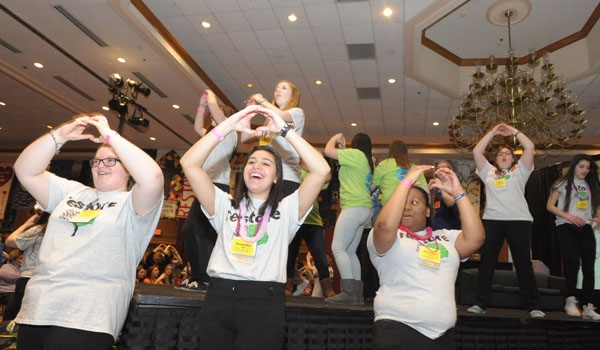 The Diocesan Youth Board gets the crowd fired up at the opening of the 63rd Diocesan Youth Convention at Adam's Mark Hotel.