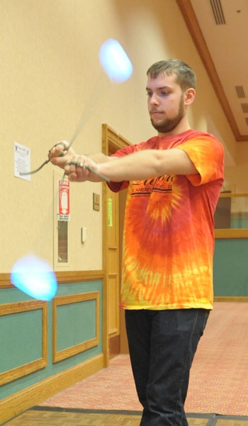 Patrick Snyder from St. Andrew performs fire spinning with LED lights at the 63rd Diocesan Youth Convention at Adam's Mark Hotel.