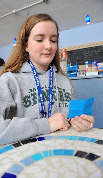 20150209 - Cailey McGillicuddy, president of Mount St. Mary Academy's Friends of Rachel Club, reads her personal affirmation. As part of a self-confidence project students were asked to write down something positive about themselves and read it throughout the day.
(Patrick McPartland/Staff Photographer)