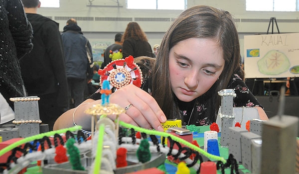 Saints Peter and Paul, Hamburg, student Hannah Johnson makes some last minute adjustments to her Aquatic city model at the Western New York Regional Future City Competition. The competition was held at Mt. St. Mary Academy.
(Patrick McPartland/Staff Photographer)
