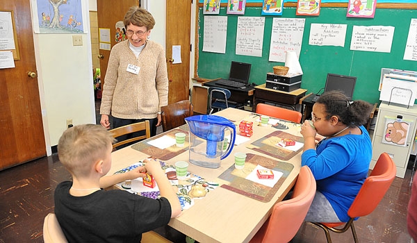 Sister Betty Neumeister, OSF, director of the Francis Center, says hello to her students at the after school program at Francis Center Niagara Falls.
(Patrick McPartland/Staff Photographer)