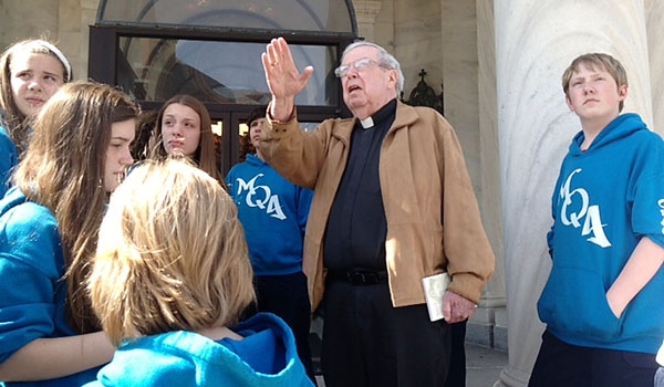 Msgr. Kevin O'Neill interacting with students from Mary Queen of Angels Regional Catholic School.
(Courtesy of Mary Queen of Angels Regional Catholic School)